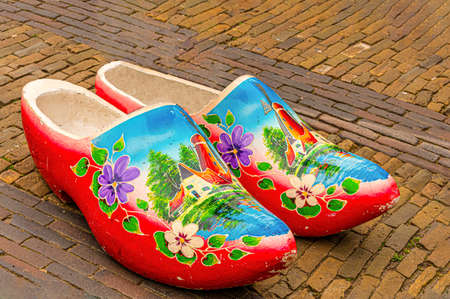 old street in the historic center of the city of Breda with traditional multicolored swedish shoes.の写真素材