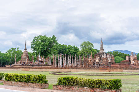 Sukhothai, Thailand-October 20, 2020:  Unidentified tourists walking the ruins of ancient temple at Sukhotai Historical Park, UNESCO world heritage and Famous Tourist Destination in Northern Thailandのeditorial素材