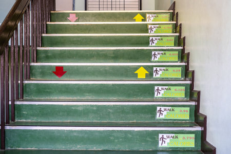 Signs of calories burn on the stairs at office when people going up and going down staircase,...