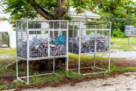 Suphan Buri, Thailand - July 12, 2021: Used water bottles and kept in the trash. Plastic bottles are...