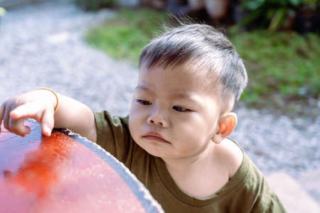 Close up of Asian child boy's face with tears. Upset crying and mad little toddler boy. Eye drop, teardrop of little sweetheart kid. An emotional child misses his mom. Childhood conceptの写真素材