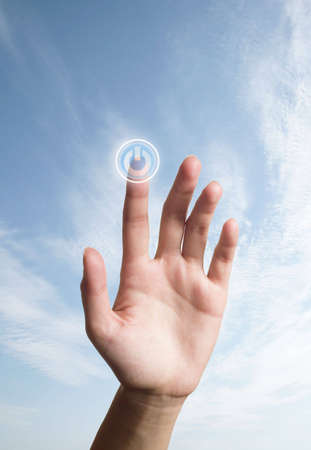 The hand presses the button (turn on)