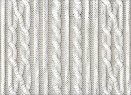 Knitted white texture with a pattern 
