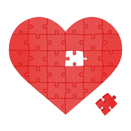 Red heart made of puzzles on a white backgroundの写真素材