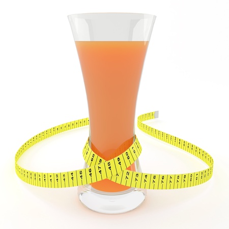 Glass of juice with a measuring tape - symbolizes a slender waistの写真素材