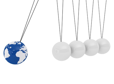 Pendulum three-dimensional white spheres and globe  on a white background - symbolizes the impact of the global economyの写真素材
