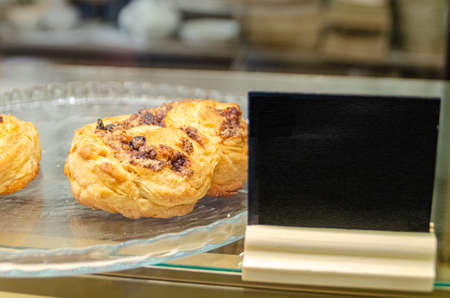 French sweet bun. On a white plate High quality photo