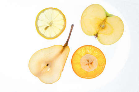 Fruit slices on a white background. High quality photo