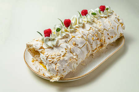 chocolate biscuit cake with nuts. with condensed milk on a white platter High quality photoの写真素材