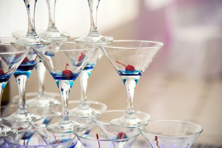 Pyramid of glasses with champagne with smoke. Festive alcohol. Alcohol at the party.の写真素材