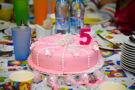 Birthday cake sweet. A children's holiday. Dessert for children. Food symbol. A cake with candles.の写真素材