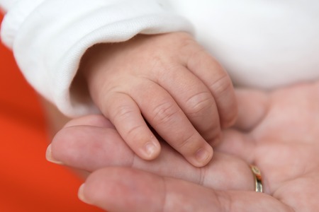 The tenderness of motherhood is in the details. Procreation in childbirth and love.の写真素材