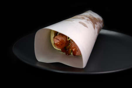 Flour tortilla with filling on a platter.の写真素材