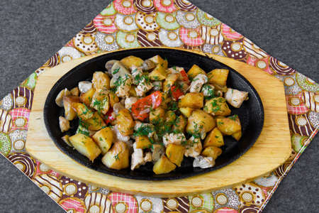 Served dish with vegetables on the table.の写真素材