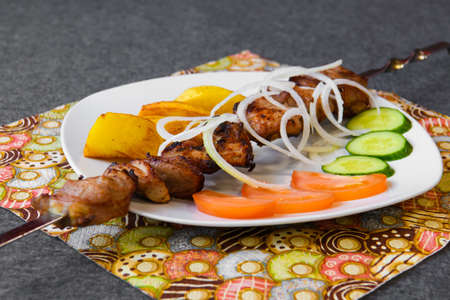 Eastern cuisine - meat shish kebab on a platter.の写真素材