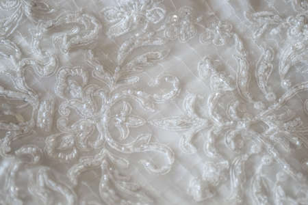 Background of the lace white dress of the bride.