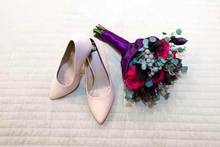 Accessories shoes and bridal bouquet for the wedding.の写真素材