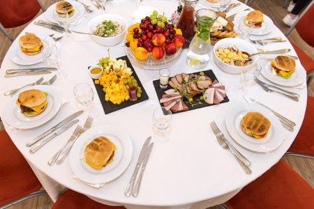 Restaurant table set with variety of food and drink. Top viewの写真素材