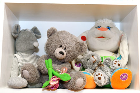A group of teddy bears in a white box close-up