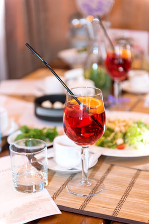 Sangria in a glass on a table in a restaurant.の写真素材