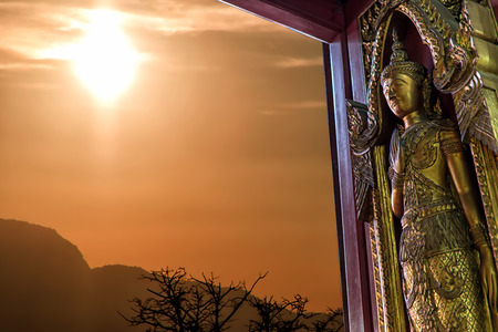 temple door decorated on wood carved gold paint ,thai style in temple, Thailandの写真素材