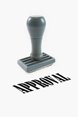 rubber stamp with the word approved isolated on white backgroundの写真素材