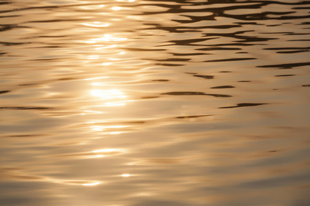 Sparkle of reflection on the river in the eveningの写真素材