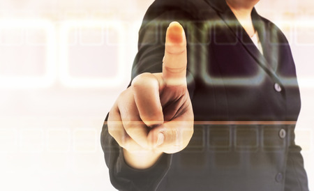 hand pushing on a touch screen interfaceの写真素材