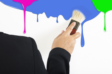Businessman paint colorful dripping backgroundの写真素材