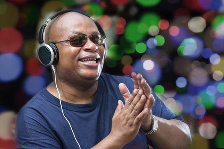 Excited man listening to headphone