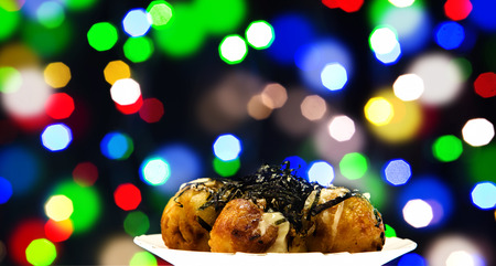 Takoyaki japanese food on bokeh backgroundの写真素材