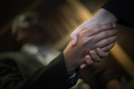 Closeup shaking hands greeting each otherの写真素材