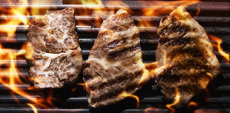 meat on Barbecue Grill Flames