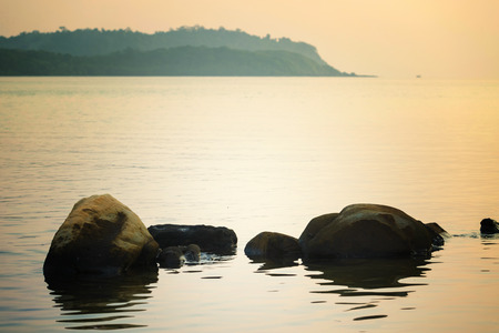 Sea and rock at the sunset.の写真素材