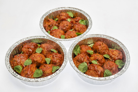Meatballs with tomato sauce on the foil cupの写真素材