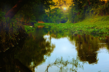 Evening rural landscape with meandering riverの写真素材