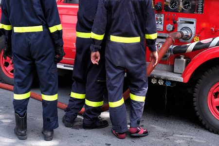 Fireman with fire trucksの写真素材