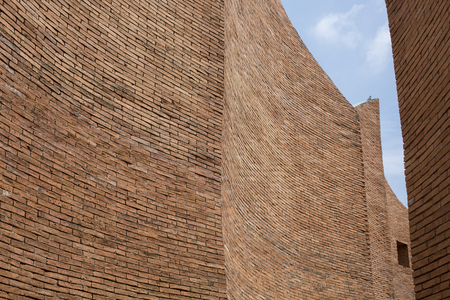 high red brick walls with a blue sky,の写真素材
