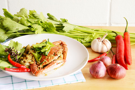 sea crab fried in yellow curry and celery leafの写真素材