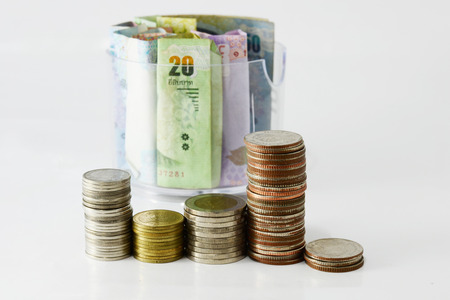 bundle of money bill and pile of coin