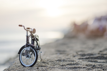 bicycle toy on sunset beach time holidayの写真素材