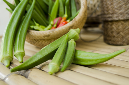 Okra and chili organic in bamboo bastket ready for cook vegetable clean foodの写真素材