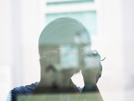 men photographer on mirror