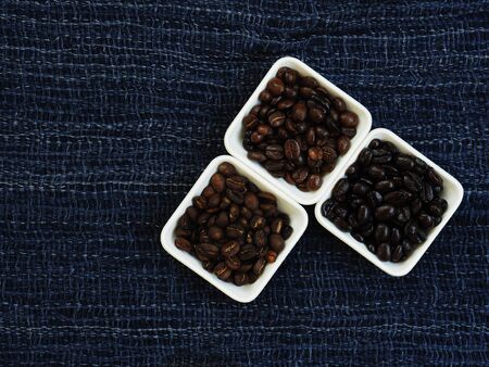 black coffee and coffee beans on wood background pea burryの写真素材