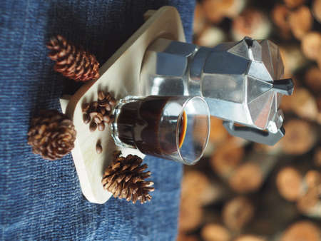 mokapot and coffee maker for fresh morning great day with fire woods wall