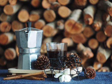 mokapot coffee maker refresh morning with firewoods backgroundの写真素材