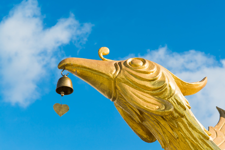Crane bird with bell statueの写真素材