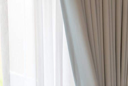 White door curtain with sunlight in the morningの写真素材