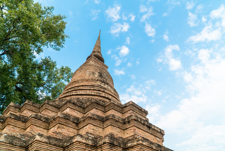 Low angle of old pagoda in the temple at Sukhothai Historical Park in Sukhothai Province, Thailandの写真素材