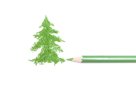 Green pencil and figure of a fur-tree from core crumbs の写真素材